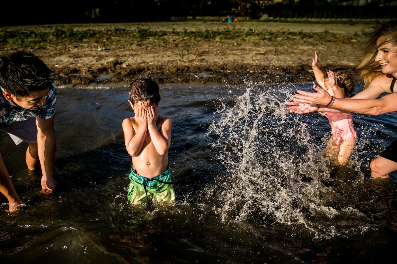 Victoria BC Family Photographer | family at the beach splashing